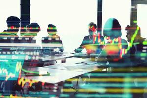 Silhouette of business people trading in office photo