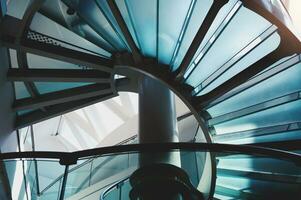 Modern glass staircase in a offices building photo