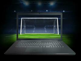 En Vivo transmisión de un fútbol jugador partido en un ordenador portátil foto