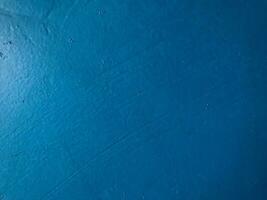 Blue painted surface as background texture photo