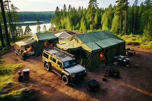 Tourist tents stand on the lawn in the middle of the forest in sunny weather. There is a car next to the tents. Drone view. AI Generative photo