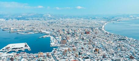 Beautiful landscape and cityscape from Hakodate Mountain with Snow in winter season. landmark and popular for attractions in Hokkaido, Japan.Travel and Vacation concept photo