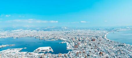 Beautiful landscape and cityscape from Hakodate Mountain with Snow in winter season. landmark and popular for attractions in Hokkaido, Japan.Travel and Vacation concept photo