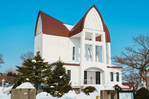 Episcopal Church with snow in winter season, founded by an English priest who visited Hakodate in 1874. landmark and popular for attractions in Hokkaido, Japan. Travel and Vacation concept photo