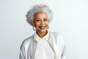 Beautiful elderly African American woman in a light-colored shirt and cardigan posing on a white background. Woman looking at the camera and smiling.  AI Generative photo