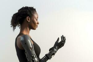 A disabled African American woman in a black t-shirt with a prosthesis instead of arms poses on a white background. Woman looking at prosthesis and smiling. AI Generative photo