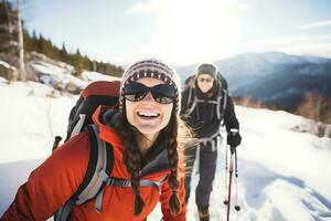 AI Generative. Couple of tourists in ski suits are climbing up at snow-covered mountain trail against the backdrop of a beautiful winter mountain landscape. photo