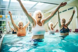 Elderly happy women do aqua aerobics in the indoor pool. Women look at the instructor and repeat the exercises. AI Generative photo