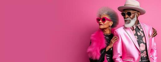 Beautiful fashion senior African American woman and man posing in trendy pink clothes on pink background. AI Generative photo