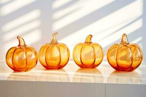 AI Generative. Several transparent glass vases in the form of an orange pumpkin stand on the table illuminated by the sun's rays. Horizontal photo