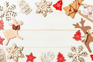 Top view of Christmas decorations and toys on wooden background. Copy space. Empty place for your design. New Year concept photo