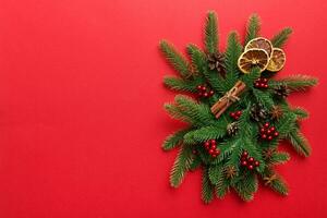 Christmas background with fir branches and Christmas decor. Top view, copy space for text photo