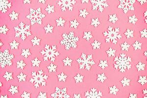 Top view of winter ornament made of white snowflakes on colorful background. Happy New Year concept with copy space photo