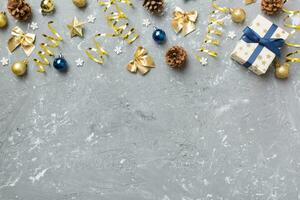 New Year composition. Christmas decor background with pine cones. Top view with copy space photo
