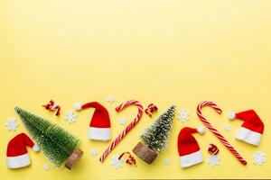 Flat lay composition with christmas trees on color background. Top view with copy space photo