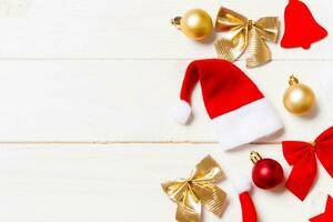 Top view of Christmas decorations and toys on wooden background. Copy space. Empty place for your design. New Year concept photo