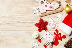 Top view of Christmas decorations and toys on wooden background. Copy space. Empty place for your design. New Year concept photo