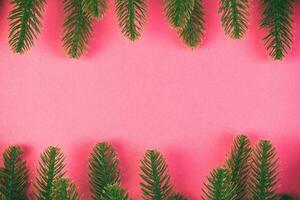 Top view of colorful festive background made of fir tree branch. Christmas holiday concept with copy space photo