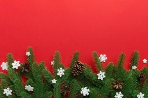 Christmas background with fir branches and Christmas decor. Top view, copy space for text photo