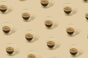 Creative trendy pattern made of coffee on pastel background. Minimal concept. photo