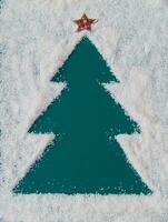 Christmas tree made in snow. Creative winter background with copy space. Minimal Christmas or New Year concept.  Fancy winter holidays layout. Christmas aesthetic. photo