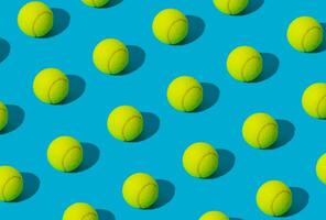 Trendy tennis ball pattern on light blue background. Minimal sport concept. Creative tennis ball pattern idea. Tennis aesthetic. photo