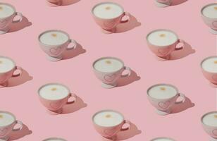 Trendy pattern made of pink and white cup of coffee on pastel pink background. Creative coffee concept. Minimal pattern background idea. Coffee aesthetic. photo