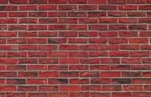 Close up view of a red brick wall. Texture of old dark brown and red brick wall panoramic background. Minimal pattern background concept. Trendy brick wall background idea. Copy space. photo