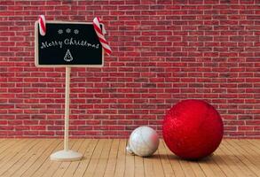 Creative composition made with Christmas baubles and  Merry Christmas message on black board against red brick wall background. Minimal Christmas or New Year concept. Trendy winter holidays idea. photo