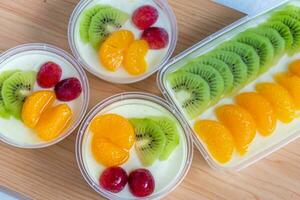 Fruity milk pudding, sweet chocolate silk pudding dessert with fruit topping photo