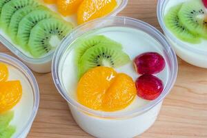 Fruity milk pudding, sweet chocolate silk pudding dessert with fruit topping photo