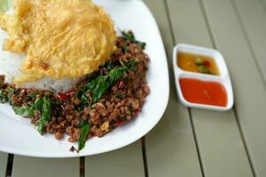 Beef basil, omelet in a plate photo