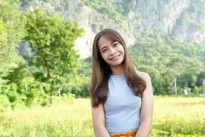 Female tourist smiling happily in nature photo