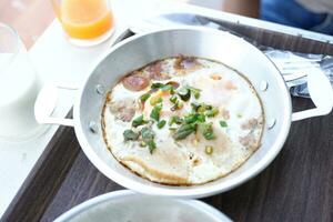 Pan-fried eggs, breakfast for tourists photo