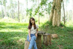 world saving concept Happy female tourist amidst forest photo