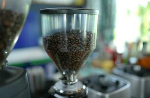 Coffee beans in a jar for grinding photo