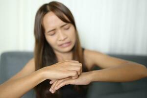 Asian woman has itchy hands photo