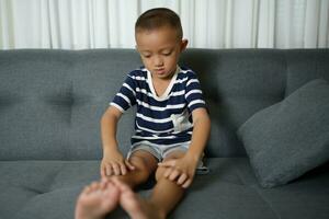 Asian boy has itchy skin from fungus photo