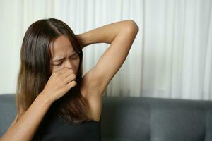 Asian woman has itchy armpits and smells photo