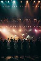 Concert crowd in front of a bright stage with lights and smoke. AI Generative photo