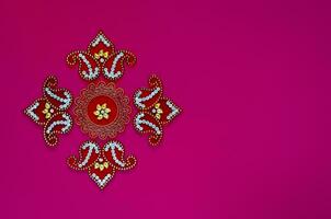 Diwali festival decorative object that can put with diwa lamp for decoration on purple background. photo