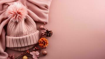 Assorted knitted garments and comfortable accessories background with empty space for text photo