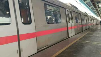 New Delhi India - October 09 2023 - Delhi Metro train arriving at Jhandewalan metro station in New Delhi, India, Asia, Public Metro departing from Jhandewalan station video