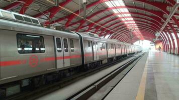 New Delhi India - October 09 2023 - Delhi Metro train arriving at Jhandewalan metro station in New Delhi, India, Asia, Public Metro departing from Jhandewalan station video