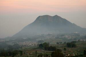 view of the mountain peak at sunrise in the morning photo