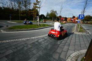 Kids on karting competition at amusement park. photo