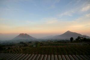 view of the mountain peak at sunrise in the morning photo