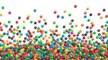 Colorful coated chocolate candies scattered on white background photo