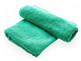 green towel isolated over white background photo