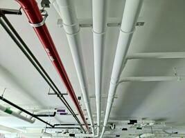 Pipes under the building for drainage systems and electrical pipes. photo